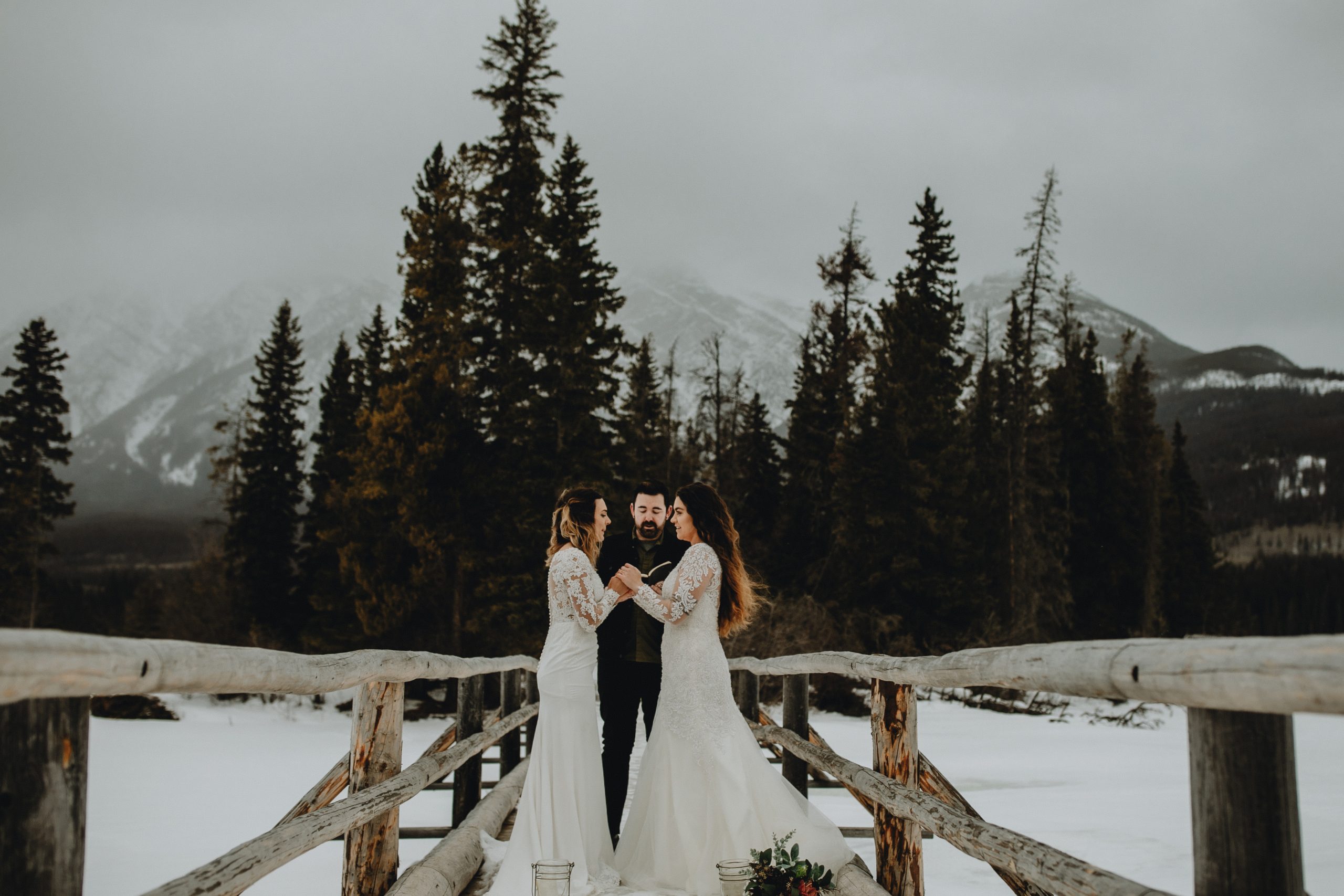 Same sex wedding, bride and bride eloping in Jasper National Park. Pyramid Lake Elopement. Love is love.