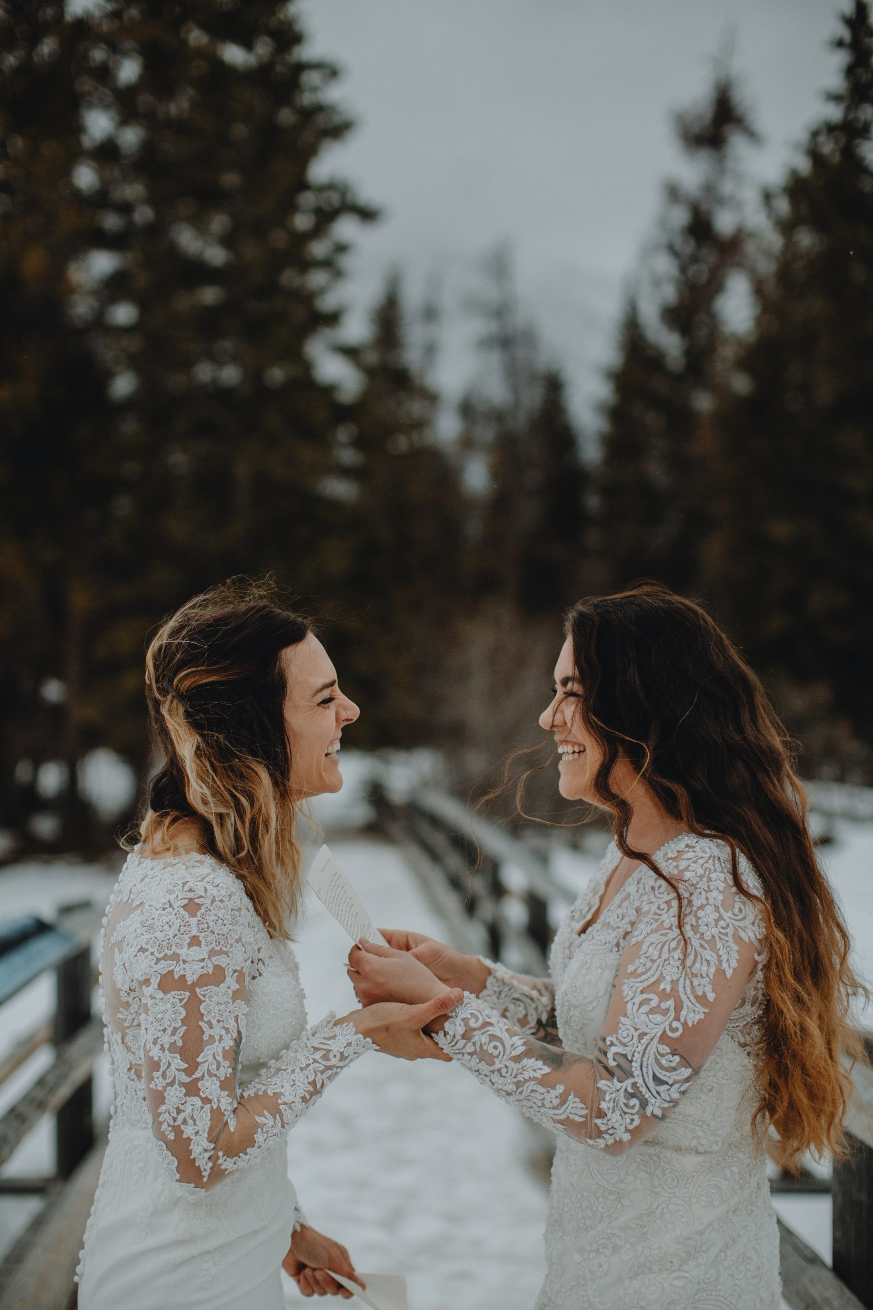 Same sex wedding, bride and bride eloping in Jasper National Park. Pyramid Lake Elopement. Love is love.
